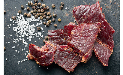 Dehydrated Food, beef jerky and spice on an old-table